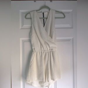 White romper with low backless zipper detail